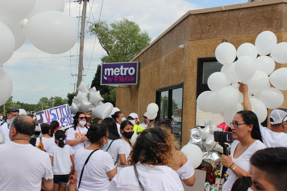Residents gather outside of the Metro by T-Mobile store in Elsmere to demand justice for Leslie Lizet Basilio on Sunday, May 23, 2021.