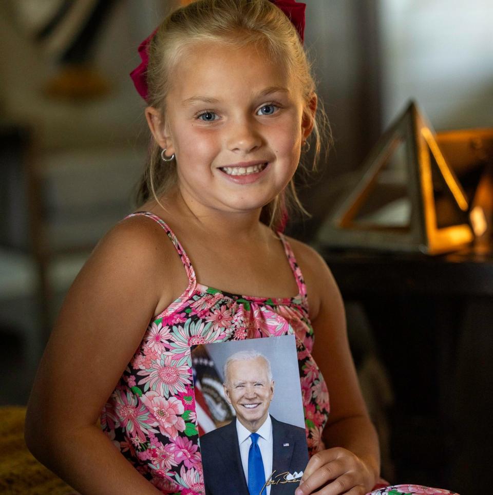 Navy Roberts with the picture of Joe Biden, her grandfather, that she keeps in her room