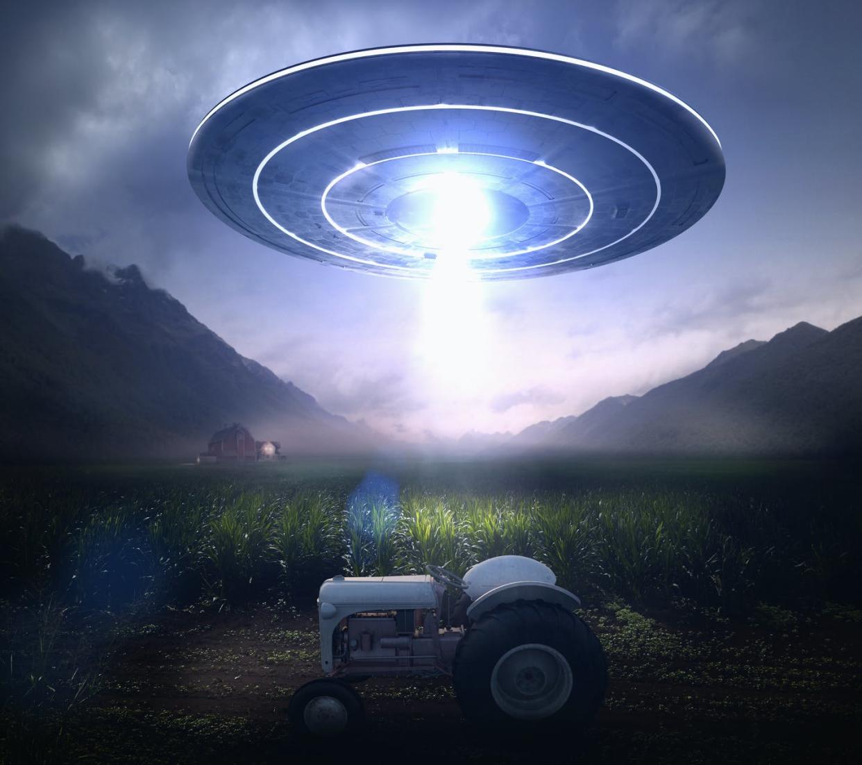 <span class="caption">People who believe aliens have visited Earth are less likely to trust the 2020 election results.</span> <span class="attribution"><a class="link " href="https://www.gettyimages.com/detail/photo/beam-from-ufo-over-tractor-at-farm-royalty-free-image/672154467" rel="nofollow noopener" target="_blank" data-ylk="slk:Colin Anderson Productions pty ltd/DigitalVision via Getty Images;elm:context_link;itc:0;sec:content-canvas"> Colin Anderson Productions pty ltd/DigitalVision via Getty Images</a></span>