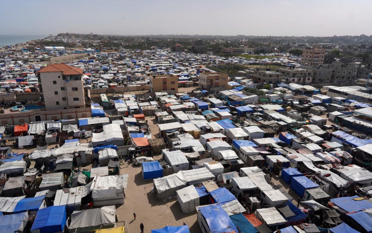 Tents housing internally displaced Palestinians crowd the coastline in Deir el-Balah in the central Gaza Strip on May 10, 2024