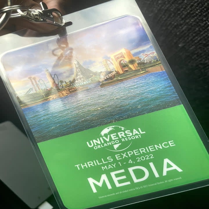 A close up photo of a Universal Orlando Resort press pass with the date included