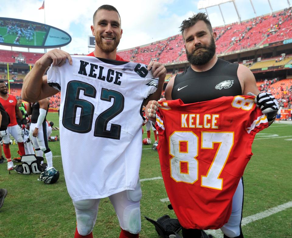 Chiefs tight end Travis Kelce, left, and his brother, Eagles center Jason Kelce, exchange jerseys following a game in Kansas City, Sunday, Sept. 17, 2017.