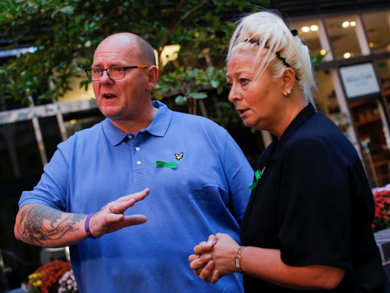 Tim Dunn and Charlotte Charles speak during their visit to Donald Trump: Reuters