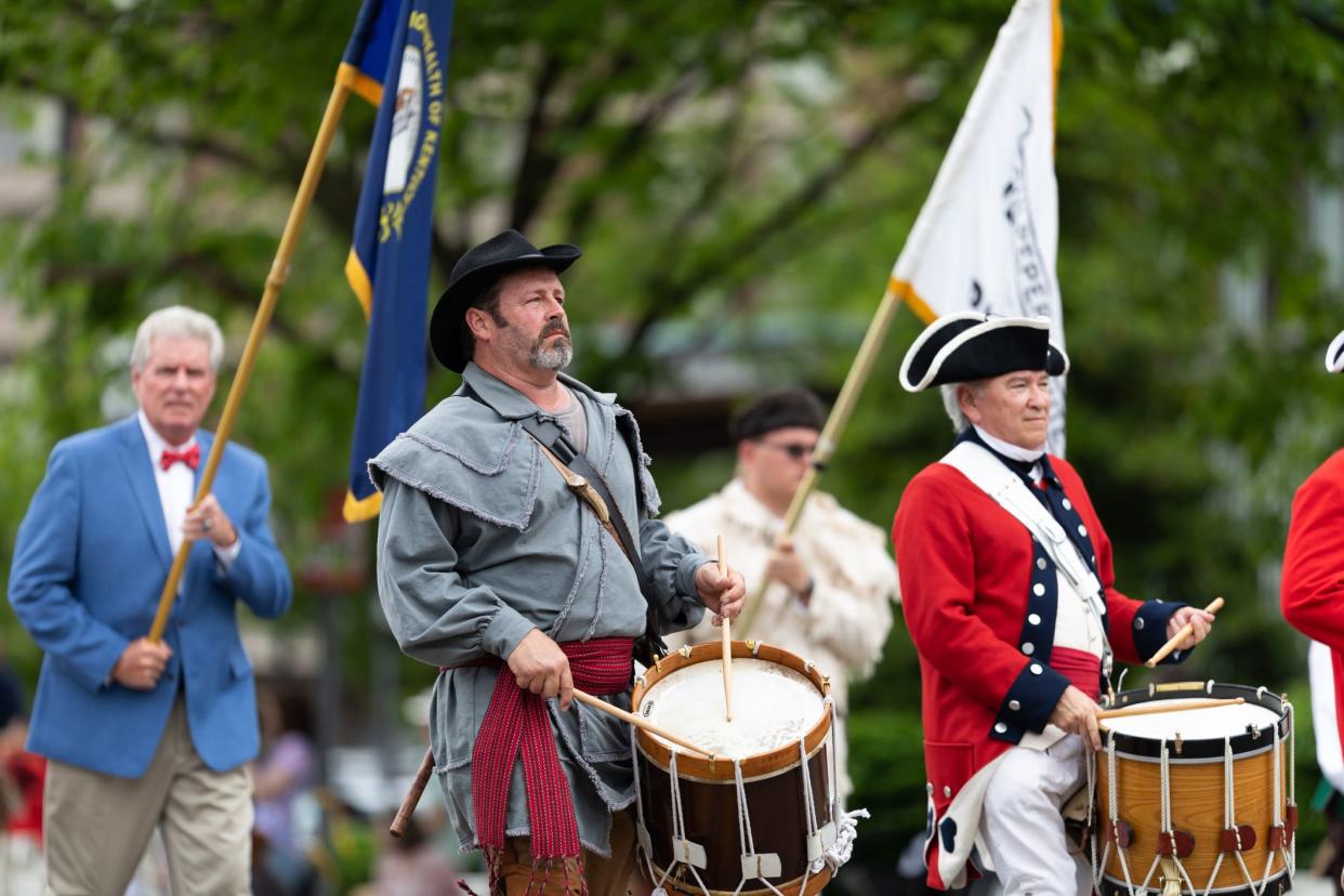 Louisville, Kentucky, USA - May 2, 2019: The Pegasus Parade, Members of the Sons of the American Revolution, wearing traditional clothing marching down the street during the parade