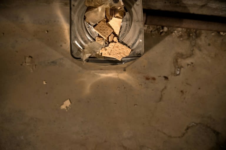 An opened can of survival biscuits is seen in a former Civil Defense fallout shelter beneath in Washington; Authorities calculated the amount of rations needed to ensure inhabitants' survival for two weeks