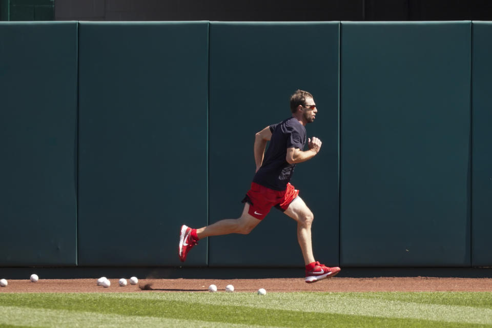 Washington Nationals starting pitcher Max Scherzer runs during a baseball workout at Nationals Park, Monday, April 5, 2021, in Washington. The Nationals are scheduled to play the Braves on Tuesday. (AP Photo/Alex Brandon)