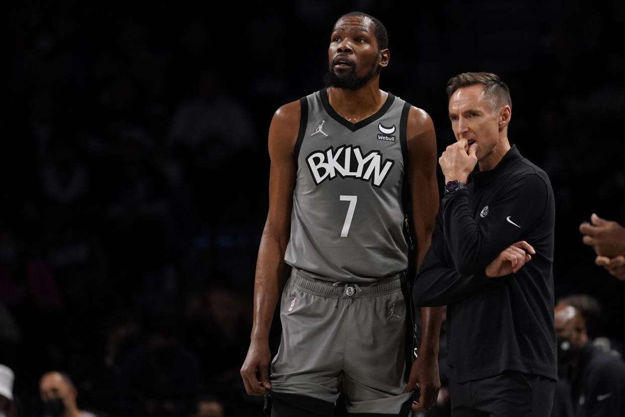 Brooklyn Nets head coach Steve Nash talks to forward Kevin Durant during a game on Oct. 29, 2021, in New York. (AP Photo/Mary Altaffer)