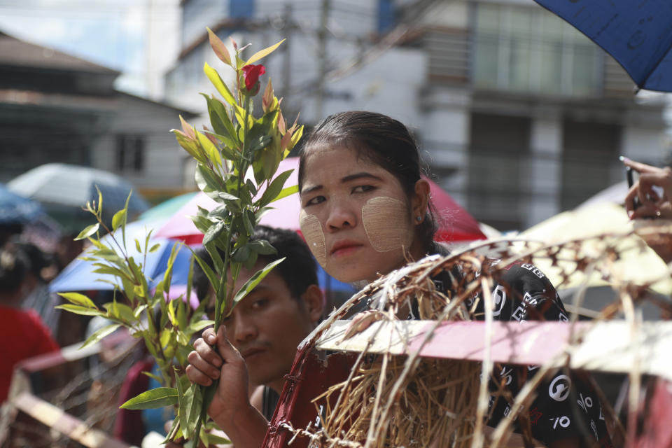 Family members and friends wait to welcome released prisoners outside the Insein Prison Tuesday, Oct. 19, 2021, in Yangon, Myanmar. Myanmar's government on Monday announced an amnesty for thousands of prisoners arrested for taking part in anti-government activities following February's seizure of power by the military. (AP Photo)