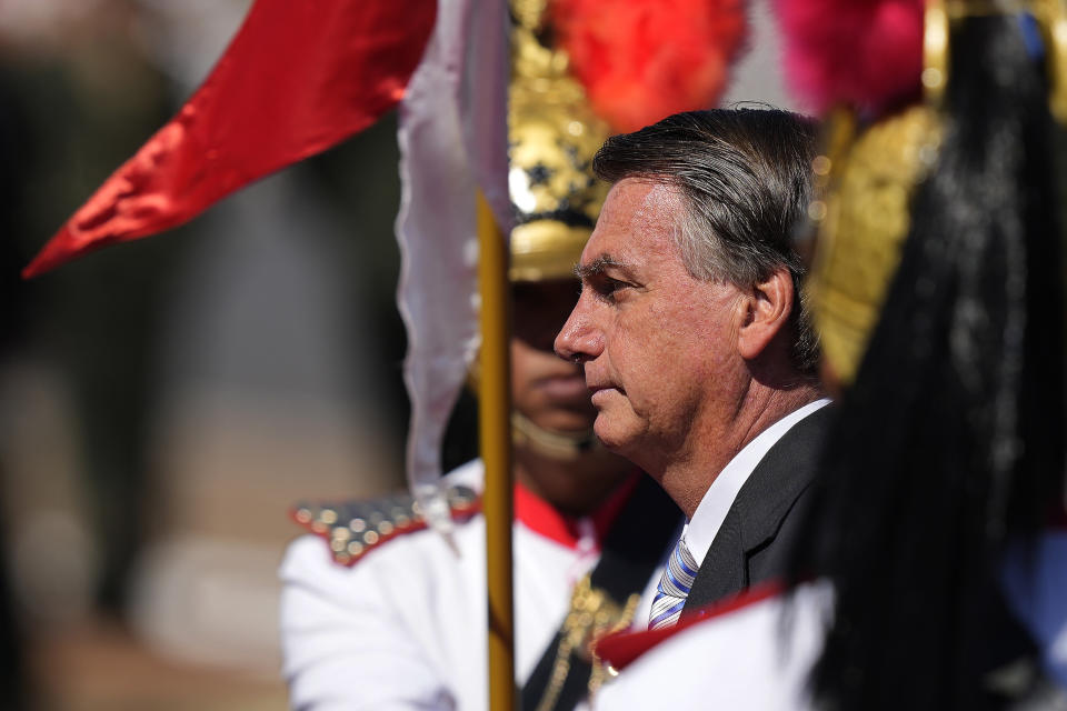 Brazilian President Jair Bolsonaro arrives for a ceremony to mark Soldier's Day at Army headquarters in Brasilia, Brazil, Thursday, Aug. 25, 2022. (AP Photo/Eraldo Peres)