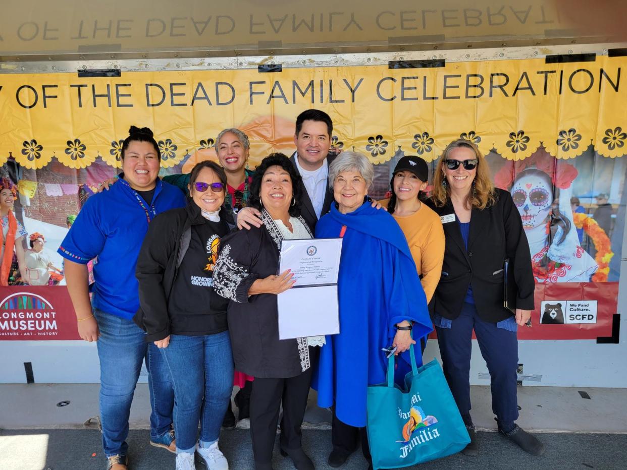 Betty Aragon-Mitotes, center, was awarded the 2023 Polly Baca Raíces Fuertes Community Leader Award for Colorado's Second Congressional District during Longmont's 2023 Dia de los Muertos event on Oct. 14, 2023, in Longmont, Colo.