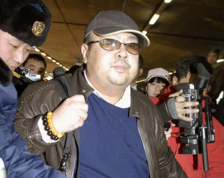 FILE PHOTO: Kim Jong Nam arrives at Beijing airport in Beijing, China, in this photo taken by Kyodo February 11, 2007. Mandatory credit Kyodo/via REUTERS/File photo