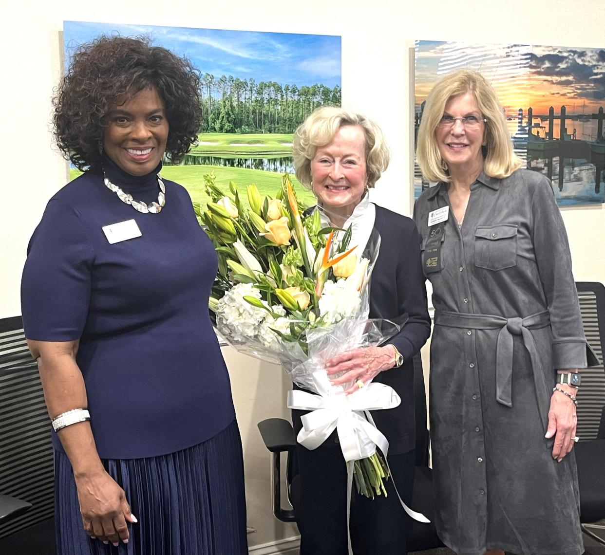 Nassau County Council on Aging President and CEO Janice Ancrum, left, and board chairwoman Karen Hackett, right, welcome philanthropist Julie Wood, whose family foundation donated $4.9 million to the council.