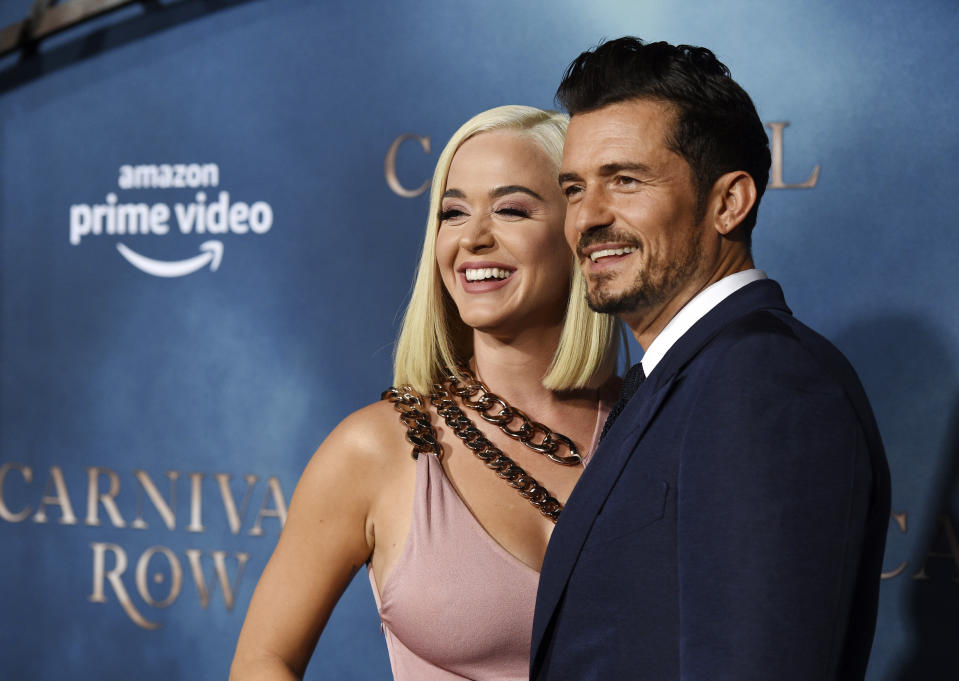 Orlando Bloom, right, a cast member in the Amazon Prime Video series "Carnival Row," poses with his girlfriend, singer Katy Perry, at the premiere of the series at the TCL Chinese Theatre, Wednesday, Aug. 21, 2019, in Los Angeles. (Photo by Chris Pizzello/Invision/AP)