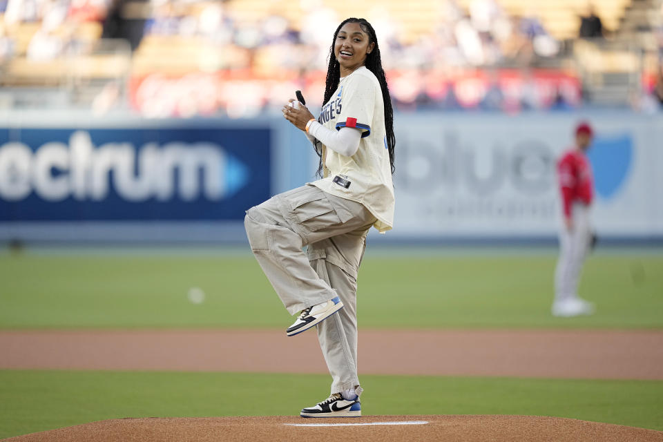 University of Southern California basketball player Juju Watkins throws out the ceremonial first pitch prior to a baseball game between the Los Angeles Dodgers and the Los Angeles Angels Saturday, June 22, 2024, in Los Angeles. (AP Photo/Mark J. Terrill)