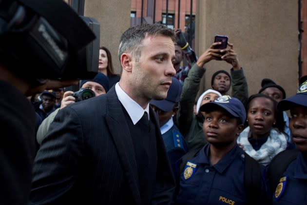 Oscar Pistorius leaves the North Gauteng High Court at the end of the day on June 15, 2016 and will return on July 6th for the final sentencing of his murder trial in Pretoria, South Africa. Having had his conviction upgraded to murder in December 2015, Paralympian athlete Oscar Pistorius is attending his sentencing hearing and will be returned to jail for the murder of his girlfriend, Reeva Steenkamp, on February 14th 2013.  - Credit: Charlie Shoemaker/Getty Images