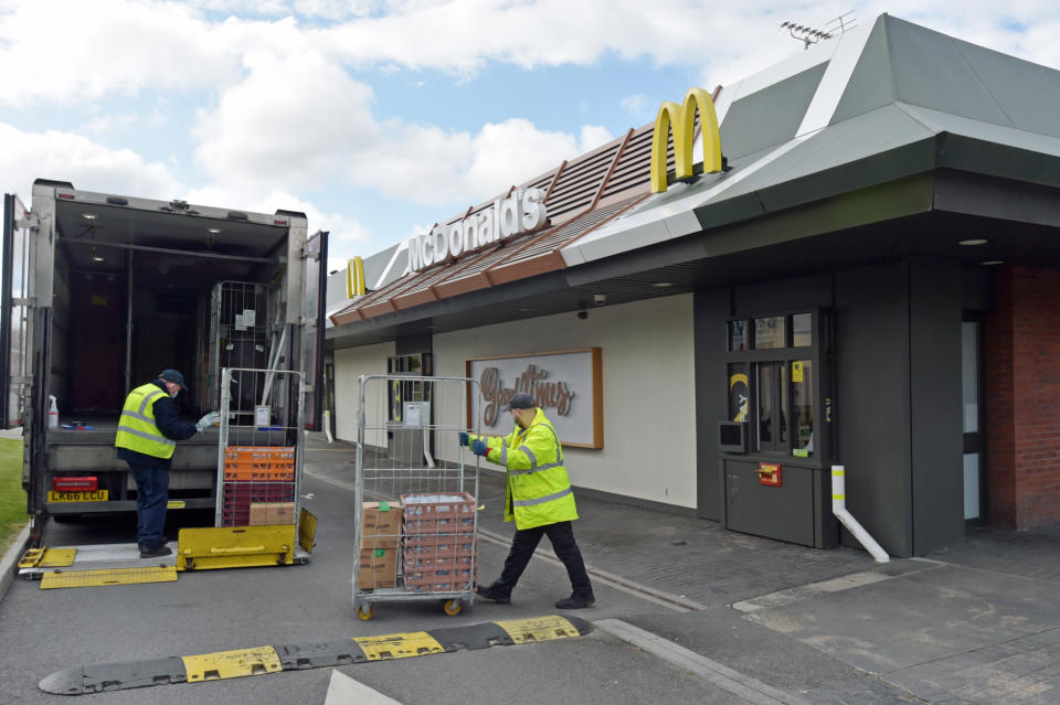 Staff members organise a delivery at a branch of McDonald's at Boreham, near Chelmsford in Essex, which one of 15 of the restaurant chain's locations which are reopening for delivery meals.