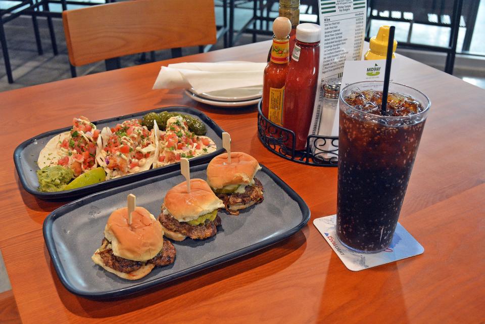 Menu items at 44 Tavern during a soft opening event for media in July featured offerings like the Midway Smashburger Sliders and the Baja Fish Tacos.