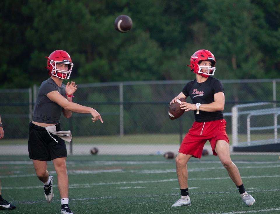 Brandon High School football quarterbacks throw during the first practice of fall camp heading into the 2023 season in Brandon, Miss., Monday, July 31, 2023. The practice began at 5:30 a.m., before sunrise, and was over by 7:30 a.m. (Syndication: The Clarion-Ledger)