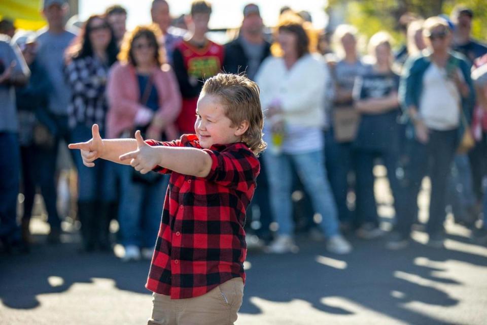 Jakob Richmond, 4, of Mt. Sterling, shows off for the judges at the mullet competition during the 2021 Mt. Sterling Court Day Festival in Mt. Sterling, Ky., on Saturday, Oct. 16, 2021.