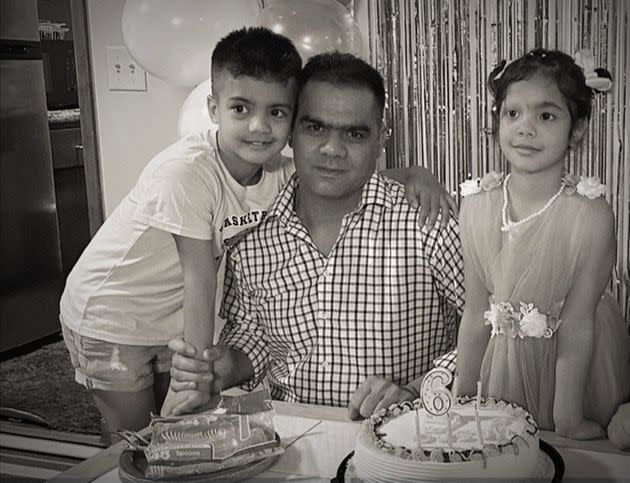 Fareed and his children celebrate a birthday after being reunited in Minnesota.