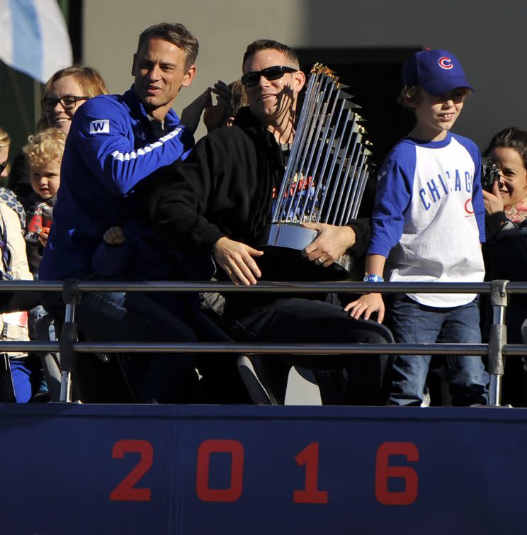 Theo Epstein holds the Commissioner’s Trophy. (AP)