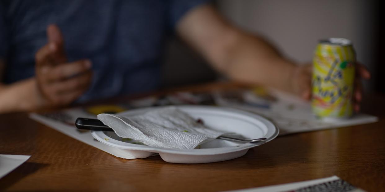 Paper plates at a dining table.