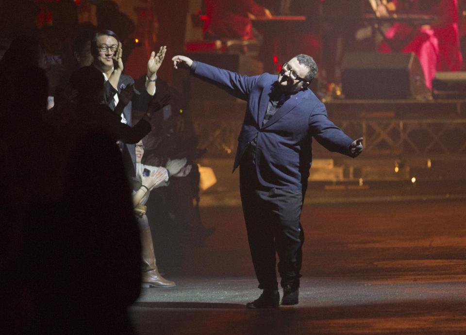 Israeli fashion designer Alber Elbaz appears athe end of the fashion house Lanvin collection for her the Fall-Winter, ready-to-wear 2013 fashion collection, during Paris Fashion week, Friday, March 2, 2012. (AP Photo/Jacques Brinon)