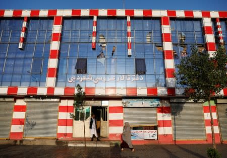 Broken windows of a wedding hall is seen after a blast in Kabul, Afghanistan