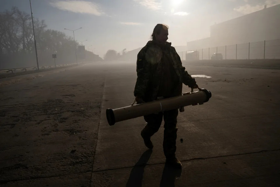 Lt. Tetiana Chornovol, the commander of an anti-tank missile unit, holds the missile tube for a Skif, or Stugna-P, system, in the outskirts of Kyiv, on March 14, 2022. (Lynsey Addario/The New York Times) -- NO SALES