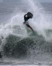 Bodyboarder Bruno Salgado, 23, performs in a wave on Copacabana beach, amid the coronavirus disease (COVID-19) outbreak, in Rio de Janeiro