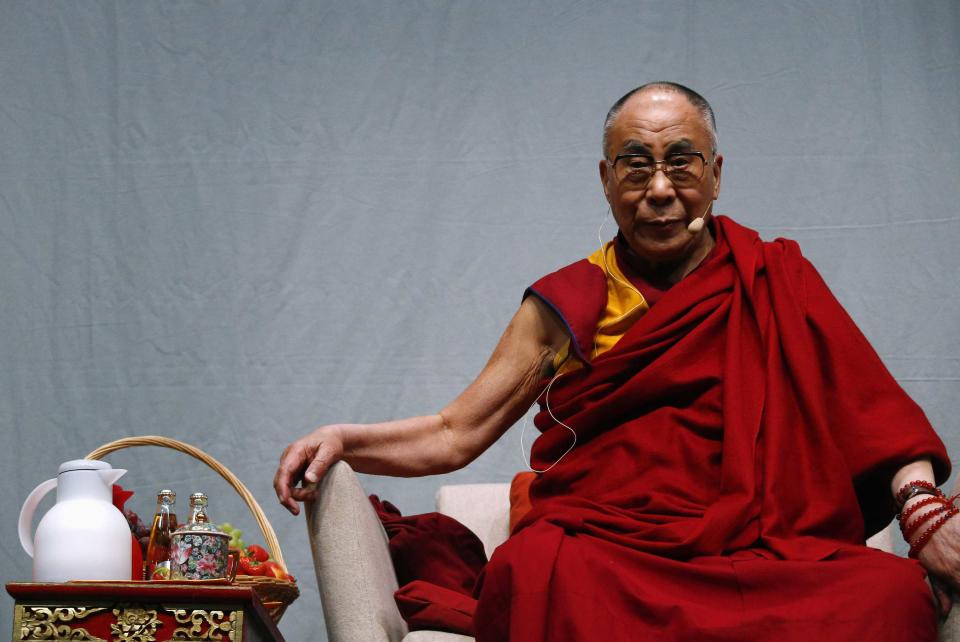 Tibetan spiritual leader the Dalai Lama looks on during a public talk at the Fraport Arena in Frankfurt May 14, 2014. The Dalai Lama is on a four-day visit to Germany. REUTERS/Ralph Orlowski (GERMANY - Tags: POLITICS RELIGION)