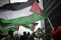 FILE - Supporters wave Palestinian flags during a protest against the Israel-Hamas war, outside the Israel Embassy in Bogota, Colombia, Oct. 24, 2023. Israel said in October that it would halt security exports to Colombia after President Gustavo Petro refused to condemn Hamas’ Oct. 7 attack on southern Israel that triggered the war and compared Israel’s actions in Gaza to those of Nazi Germany. (AP Photo/Ivan Valencia, File)