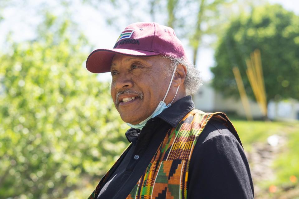 Roy Harris, co-founder, smiles inside Southside Community Farm in the historically Black Asheville neighborhood of Southside on April 27, 2022.