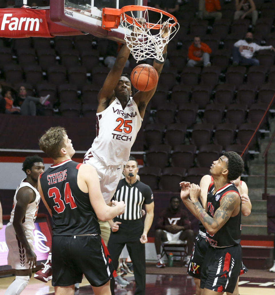 Virginia Tech's Justyn Mutts (25) scores past the VMI defense during the second half of an NCAA college basketball game, Thursday, Dec. 3, 2020 in Blacksburg, Va. (Matt Gentry/The Roanoke Times via AP, Pool)