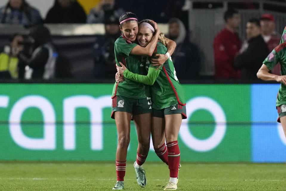 Mexico midfielder Mayra Pelayo-Bernal, right, celebrates her goal with defender Karen Luna during a CONCACAF Gold Cup women's soccer tournament match against the United States, Monday, Feb. 26, 2024, in Carson, Calif. (AP Photo/Ryan Sun)