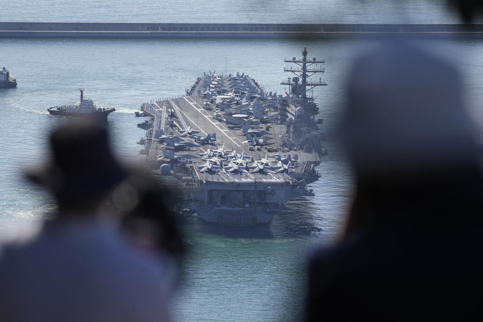 USS Ronald Reagan is escorted as it arrives in Busan, South Korea on Sept. 23, 2022. North Korea warned Saturday, Oct. 8, the U.S. redeployment of an aircraft carrier near the Korean Peninsula is causing a “considerably huge negative splash” in regional security, as it defended its recent missile tests as a “righteous reaction” to intimidating military drills between its rivals (AP Photo/Lee Jin-man)