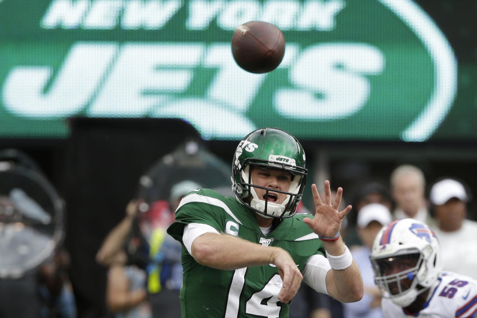 FILE - In this Sept. 8, 2019, file photo, New York Jets quarterback Sam Darnold (14) throws a pass during the second half of an NFL football game against the Buffalo Bills, in East Rutherford, N.J. Darnold has been cleared by doctors to play this week after he missed three games while recovering from mononucleosis. The Jets announced in a Twitter post that Darnold will start Sunday at home against Dallas. (AP Photo/Seth Wenig, File)