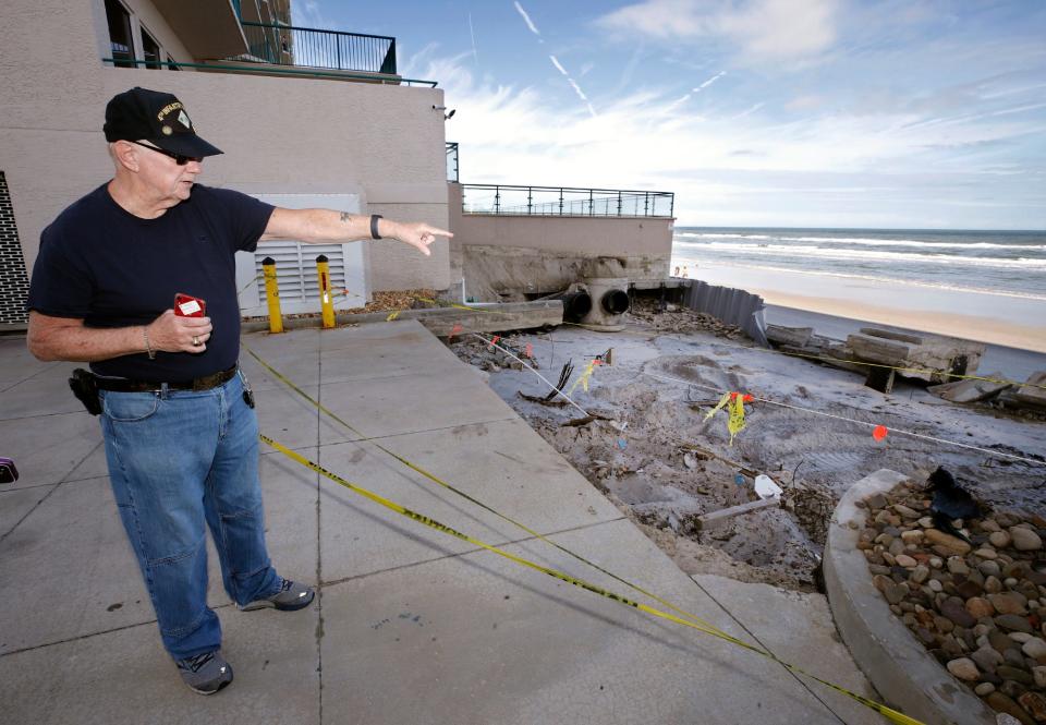 Ed Offerman, vice president of the Condominium Association at the DiMucci Towers in Daytona Beach Shores, is pictured last November amid the damage done by Tropical Storms Ian and Nicole.