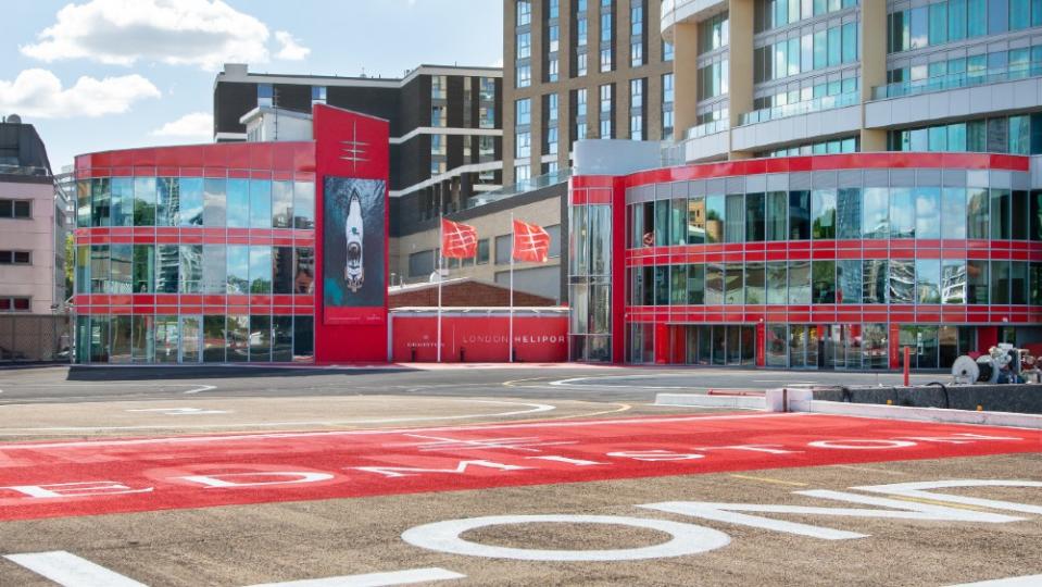 Edmiston’s corporate colors and logos at the Battersea heliport. - Credit: Courtesy Edmiston Yachts