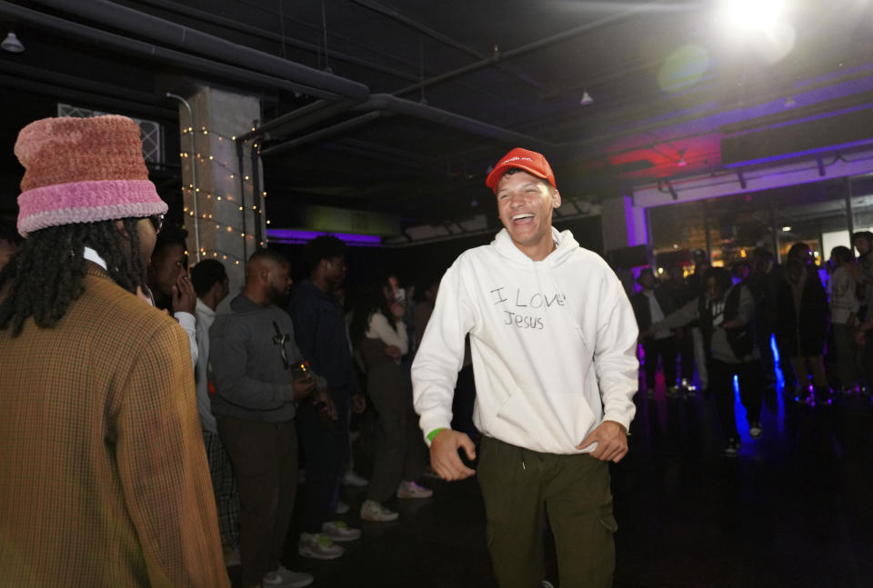 Young clubbers at The Cove, a pop-up, 18-and-up Christian nightclub, dance together to a mix of Christian rap, hip hop, gospel and reggaeton on Saturday, Feb. 17, 2024, in Nashville, Tenn. (AP Photo/Jessie Wardarski)