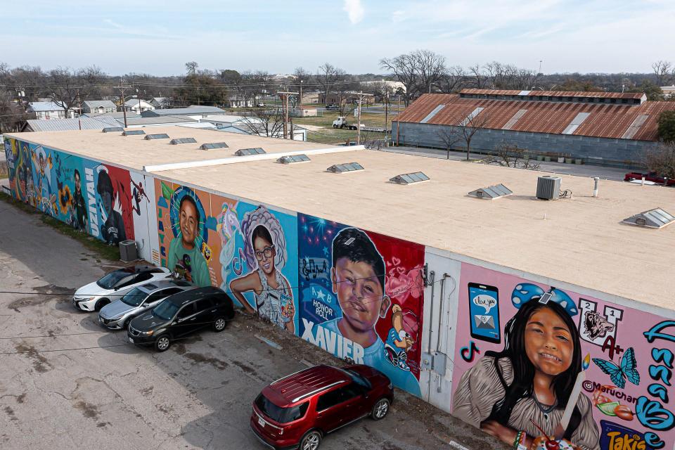 Murals of the Robb Elementary shooting victims are painted on the St. Henry de Osso building in Uvalde.