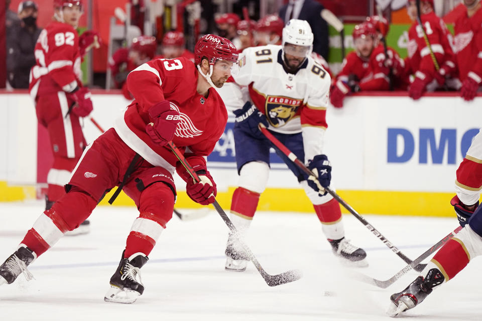 Detroit Red Wings left wing Darren Helm (43) passes the puck during the second period of an NHL hockey game against the Florida Panthers, Saturday, Jan. 30, 2021, in Detroit. (AP Photo/Carlos Osorio)