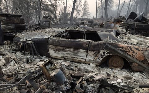 A property reduced to ashes is seen in Paradise, California - Credit: AFP