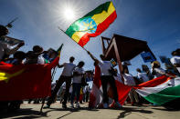 <p>People wave flags and banners in support of Tedros Adhanom Ghebreyesus of Ethiopia, candidate to the position of Director General of the World Health Organization (WHO), in front of the European headquarters of the United Nations in Geneva, Switzerland, May 23, 2017. (Photo: Valentin Flauraud/EPA) </p>