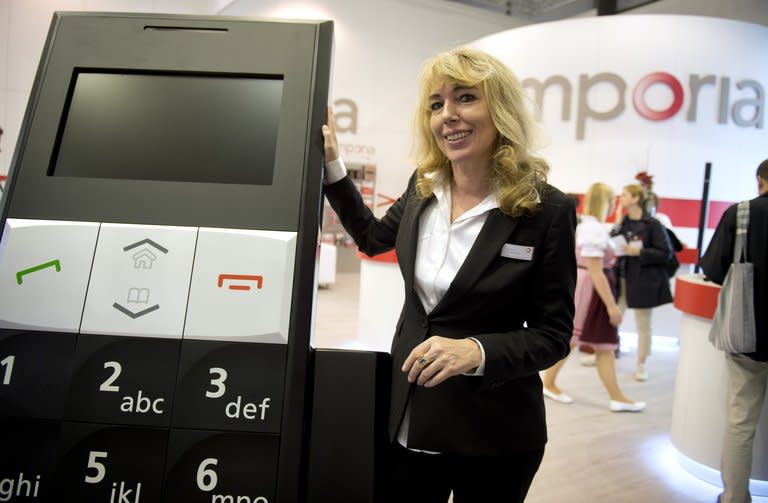 Eveline Pupeter of Emporia at the IFA trade fair in Berlin last August. A new black and silver flip phone for seniors, Emporia Connect, comes with a system called Emporia Me, allowing a child or grandchild to check the device's location, battery status, or even turn up the volume on the phone to make sure the elderly owner can hear it