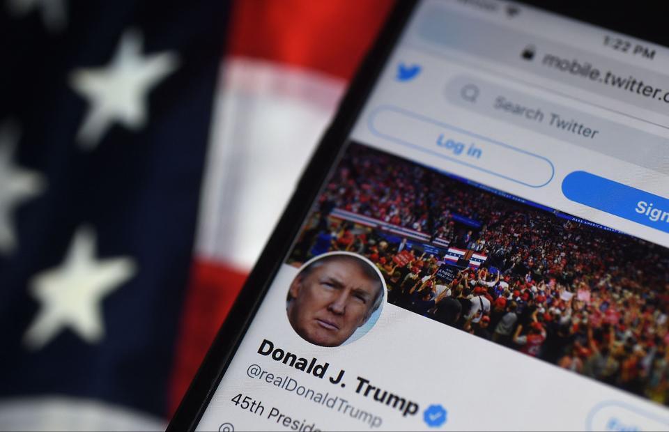 Former President Donald Trump's Twitter profile can be seen on a phone.