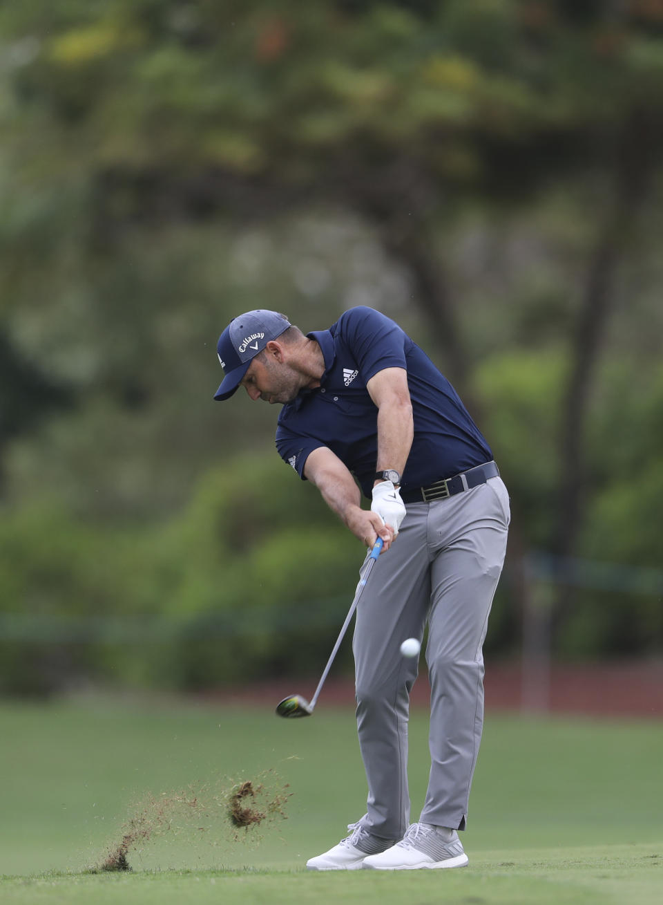 Sergio Garcia of Spain plays a shot on the 2nd hole during the first round of the DP World Tour Championship golf tournament in Dubai, United Arab Emirates, Thursday, Nov. 21, 2019. (AP Photo/Kamran Jebreili)