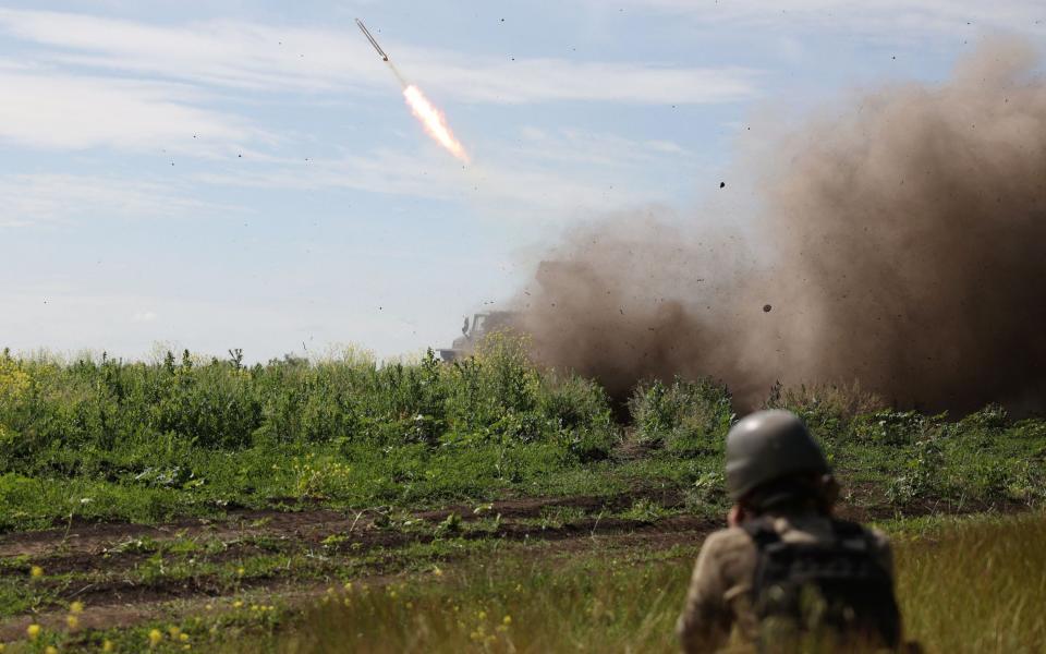 Ukrainian servicemen of the 10th Mountain Assault Brigade "Edelweiss" fire a rocket from a BM-21 'Grad' multiple rocket launcher towards Russian positions, near Bakhmut in the Donetsk region - ANATOLII STEPANOV/AFP