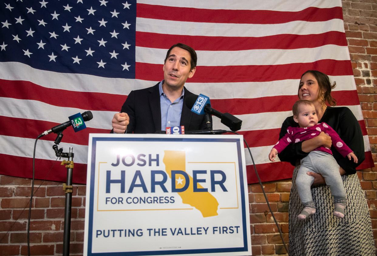 Congressman Josh Harder, with his wife Pam and 8-month-old daughter Lilian speaks during an election night party at his campaign headquarters in downtown Stockton on Tuesday, Nov. 8, 2022. 