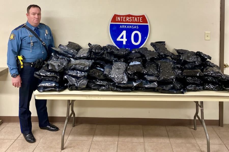 Arkansas State Police Cpl. Dallas Taylor, Troop D, with 100 pounds of marijuana seized in a Feb. 5, 2024, traffic stop